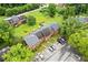 Overhead view displaying the gray roof, brick facade, landscaped yard, and private parking at 4691 Shumate Dr, Stone Mountain, GA 30083
