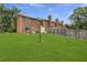 Spacious backyard with a wooden fence and mature trees at 4691 Shumate Dr, Stone Mountain, GA 30083