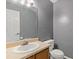 Small bathroom with a toilet, a sink and a mirror at 4691 Shumate Dr, Stone Mountain, GA 30083
