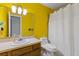 Bathroom with a standing toilet, bathtub and a sink with a vanity at 4691 Shumate Dr, Stone Mountain, GA 30083