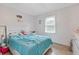 This bedroom has a cozy bed and a window for natural light at 4691 Shumate Dr, Stone Mountain, GA 30083