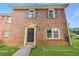 Close up of charming brick home with classic front door, providing a welcoming entrance at 4691 Shumate Dr, Stone Mountain, GA 30083
