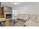 Cozy living room with a brick fireplace, hardwood floors, and comfortable seating, perfect for relaxing at 4691 Shumate Dr, Stone Mountain, GA 30083