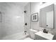 Modern bathroom features include marble tile, black fixtures, and a gray vanity at 943 Rose Sw Cir, Atlanta, GA 30310