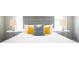 Close up of the bed showing the upholstered headboard and colorful pillows at 943 Rose Sw Cir, Atlanta, GA 30310
