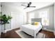 Cozy bedroom featuring a neutral color palette, ceiling fan and hardwood flooring at 943 Rose Sw Cir, Atlanta, GA 30310