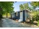 Charming home exterior with blue siding, white trim, and newly landscaped front entrance at 943 Rose Sw Cir, Atlanta, GA 30310