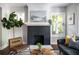 Living room featuring a fireplace, decor art and comfortable seating for a warm and inviting space at 943 Rose Sw Cir, Atlanta, GA 30310