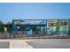 Exterior of Gusto Restaurant with a large mural and outdoor seating area at 943 Rose Sw Cir, Atlanta, GA 30310
