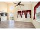Bright living room featuring a vaulted ceiling, ceiling fan, and sliding glass doors to the outside at 139 W Oaks Pl, Woodstock, GA 30188