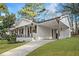 A charming single story home with a brick facade, black shutters and a covered parking area at 2198 Star Mist Sw Dr, Atlanta, GA 30311
