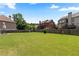 Huge grassy backyard with privacy fencing and a central decorative tree at 2602 Corey Park Dr, Loganville, GA 30052