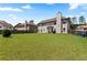 Well-manicured backyard with a lush green lawn, fenced perimeter and privacy for outdoor enjoyment at 2602 Corey Park Dr, Loganville, GA 30052