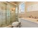 Modern bathroom featuring a glass shower, marble vanity, and updated fixtures at 2602 Corey Park Dr, Loganville, GA 30052