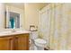 Bathroom with single sink vanity, toilet, and bathtub with shower at 2602 Corey Park Dr, Loganville, GA 30052