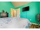 Spacious bedroom featuring hardwood floors, a TV, and an ensuite bathroom at 2602 Corey Park Dr, Loganville, GA 30052