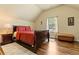 Cozy bedroom featuring hardwood floors, ceiling fan, and a window with natural light at 2602 Corey Park Dr, Loganville, GA 30052
