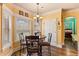 Bright breakfast nook with a table, chairs, chandelier, and large windows providing natural light and views at 2602 Corey Park Dr, Loganville, GA 30052
