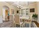 Elegant dining room with coffered ceilings, decorative china cabinet, and stylish furnishings at 2602 Corey Park Dr, Loganville, GA 30052