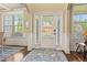 Bright foyer with hardwood floors, large windows, and elegant trim at 2602 Corey Park Dr, Loganville, GA 30052