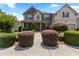 Charming two-story home with lush front yard landscaping and inviting walkway at 2602 Corey Park Dr, Loganville, GA 30052