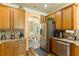 Well-equipped kitchen with stainless steel appliances, granite countertops, and wooden cabinets at 2602 Corey Park Dr, Loganville, GA 30052