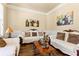 Cozy living room with hardwood floors, ornate furniture, and natural light at 2602 Corey Park Dr, Loganville, GA 30052