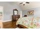 Spacious main bedroom featuring hardwood floors and an elegant wooden dresser at 2602 Corey Park Dr, Loganville, GA 30052