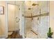 Modern shower with glass doors and double shower heads at 2602 Corey Park Dr, Loganville, GA 30052
