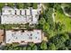 Aerial view showcases the community's layout with lush trees and well-maintained grounds at 273 12Th Ne St # 111, Atlanta, GA 30309