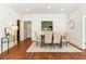 Chic dining area with hardwood floors, stylish seating, and a view into the kitchen for easy serving at 273 12Th Ne St # 111, Atlanta, GA 30309