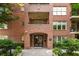 Brick building with a secure entrance and landscaped planters, offering a welcoming appeal at 273 12Th Ne St # 111, Atlanta, GA 30309