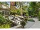 Inviting outdoor area with lush landscaping and a charming entrance to the building at 273 12Th Ne St # 111, Atlanta, GA 30309