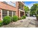 Charming brick building with inviting outdoor spaces, showcasing the property's classic architectural style at 273 12Th Ne St # 111, Atlanta, GA 30309