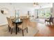 Elegant dining area flows into a living space with hardwood floors, and large windows for natural light at 273 12Th Ne St # 111, Atlanta, GA 30309