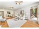 Well-lit living room with hardwood floors, comfortable seating, and access to a charming outdoor patio space at 273 12Th Ne St # 111, Atlanta, GA 30309