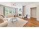 Inviting living room with a fireplace, large window, hardwood floors and comfortable seating for relaxation at 273 12Th Ne St # 111, Atlanta, GA 30309