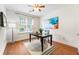 Home office space with hardwood floors, a modern desk, and plenty of natural light at 273 12Th Ne St # 111, Atlanta, GA 30309
