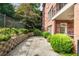 Secluded patio with brick pavers, complemented by mature landscaping and a peaceful atmosphere at 273 12Th Ne St # 111, Atlanta, GA 30309