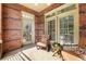 Cozy outdoor patio featuring comfortable seating and brick detailing, creating a relaxing retreat at 273 12Th Ne St # 111, Atlanta, GA 30309
