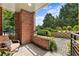 Charming patio area with brick accents, manicured landscaping, and a comfortable seating arrangement at 273 12Th Ne St # 111, Atlanta, GA 30309