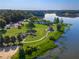 Scenic aerial view of lakeside park featuring playground, picnic shelters, winding trails, and a tranquil gazebo at 4442 Academy St, Acworth, GA 30101