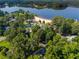 Picturesque aerial shot of a community near a sandy beach and lake, surrounded by lush green trees and serene landscapes at 4442 Academy St, Acworth, GA 30101