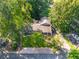 Charming home with inviting front porch, lush landscaping, and a private driveway surrounded by mature trees at 4442 Academy St, Acworth, GA 30101