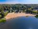Expansive lake view featuring a sandy beach, clear blue water, and recreational swimming area marked with buoys at 4442 Academy St, Acworth, GA 30101