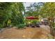 Landscaped backyard featuring comfortable seating, a gravel area, and lush greenery offering a relaxing retreat at 4442 Academy St, Acworth, GA 30101