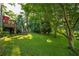 Lush backyard with a deck and staircase, offering a serene outdoor space at 4442 Academy St, Acworth, GA 30101