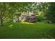 Expansive backyard with lush lawn and a deck perfect for outdoor entertaining at 4442 Academy St, Acworth, GA 30101