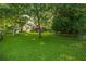 Spacious backyard featuring a lush lawn and a deck, perfect for outdoor activities and relaxation at 4442 Academy St, Acworth, GA 30101