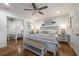 Charming bedroom features a decorative accent wall, ceiling fan, and mirrored closet doors at 4442 Academy St, Acworth, GA 30101